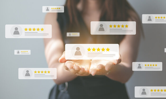 Business people using smartphone and pressing review popup on visual screen customer review by five star feedback positive customer feedback testimonial | Quick Reliable Printing (QRP) Quick Reliable Printing (QRP)