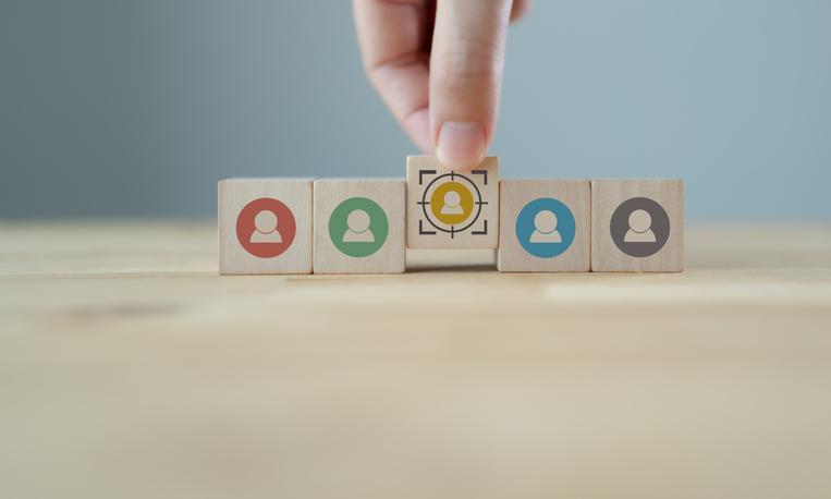 Target customer buyer persona marketing segmentation job recruitment concept Personalization marketing customer centric strategies Putting wooden cubes with focused on target customer symbolsQuick Reliable Printing (QRP)