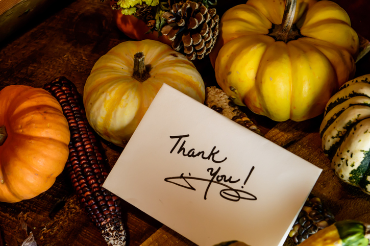 Happy Thanksgiving Card with words Thank you on handwritten card Autumn harvest on rustic wood backgroundQuick Reliable Printing (QRP)