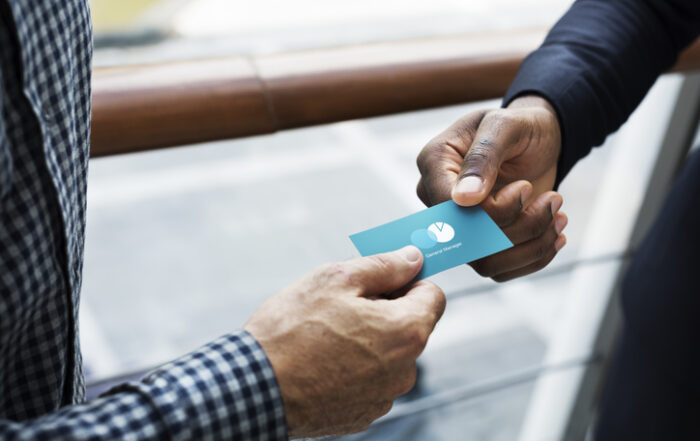 Business people exchanging a business cardQuick Reliable Printing (QRP)
