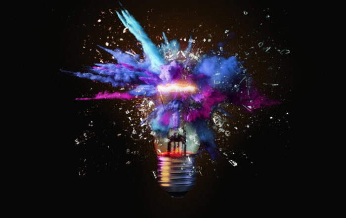Creative colored light bulb explosion with shards and paint a creative idea Think different concept Business ideas and the discovery of new technologyQuick Reliable Printing (QRP)