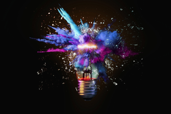 Creative colored light bulb explosion with shards and paint a creative idea Think different concept Business ideas and the discovery of new technologyQuick Reliable Printing (QRP)