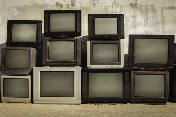 Retro old TVs pile on floor in front of old wall Stack television sets with vintage filter effect | Quick Reliable Printing (QRP) Retro old TVs pile on floor in front of old wall Stack television sets with vintage filter effectQuick Reliable Printing (QRP)