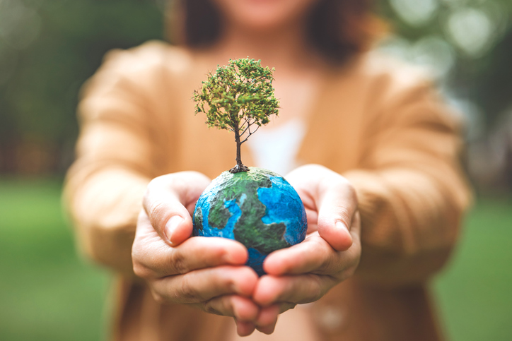 World Environment Day Earth globe ball with growing tree in woman hand save clean planet ecology concept | Quick Reliable Printing (QRP) Quick Reliable Printing (QRP)