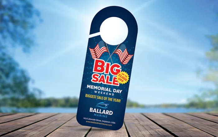 memorial-door-hanger1 | Quick Reliable Printing (QRP) Promotional sale tag on a blue background reading 'BIG SALE Memorial Day Weekend' for Ballard Marine, with two American flags.Quick Reliable Printing (QRP)