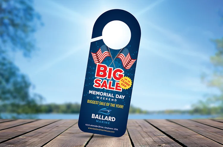 memorial-door-hanger1 | Quick Reliable Printing (QRP) Promotional sale tag on a blue background reading 'BIG SALE Memorial Day Weekend' for Ballard Marine, with two American flags.Quick Reliable Printing (QRP)